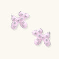 Glossy pink enamel balloon dog stud earrings with crystal details on white gold plated brass, museum-inspired design