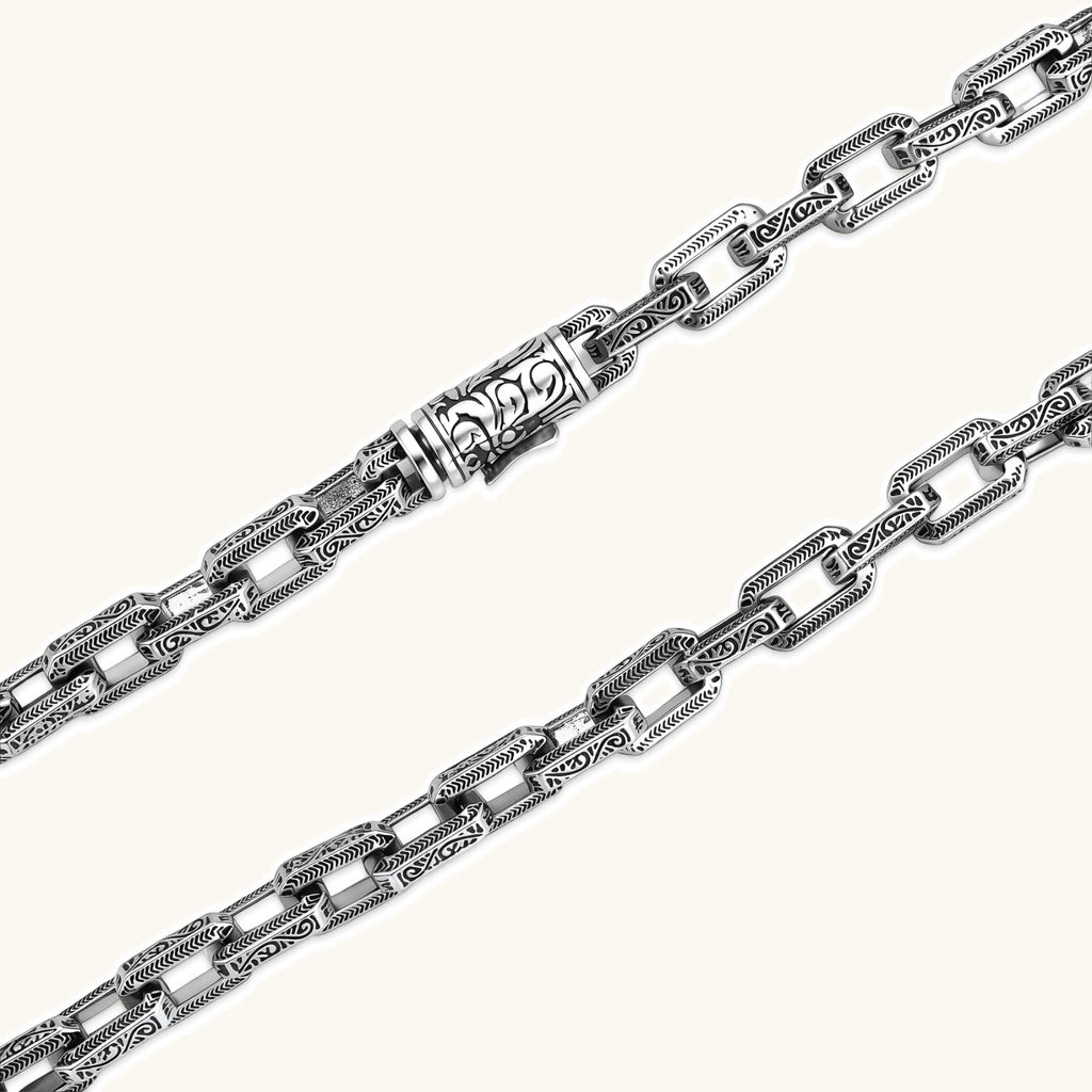 Silver 316L stainless steel rectangular link chain necklace with intricate scroll engravings, 560mm length, 7.1mm width.