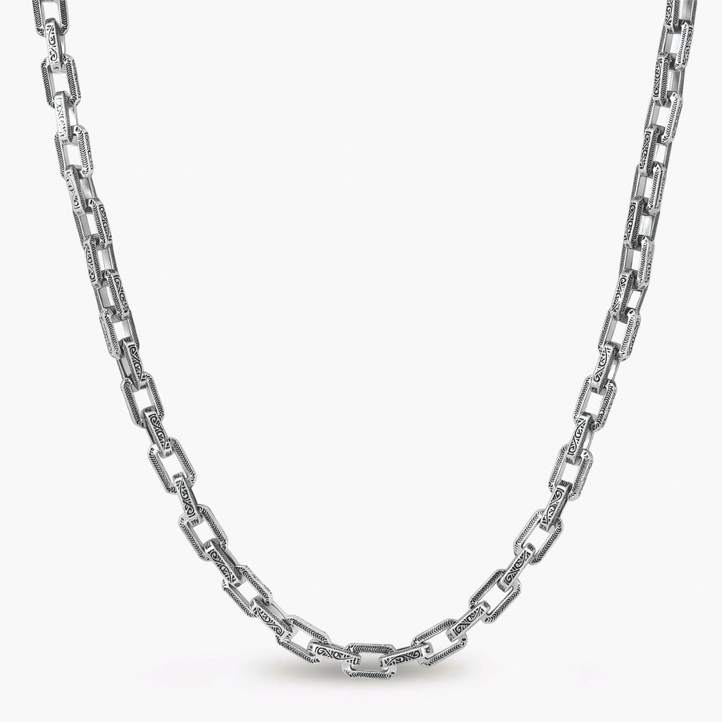 Silver 316L stainless steel rectangular link chain necklace with intricate scroll engravings, 560mm length, 7.1mm width.