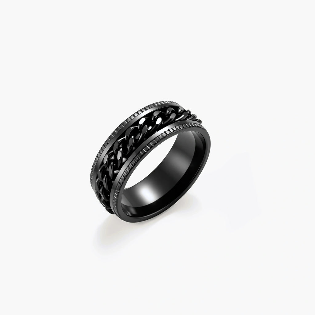Black PVD-plated stainless steel band ring with a rotating Cuban chain center strip and ridged edges, 8mm wide.